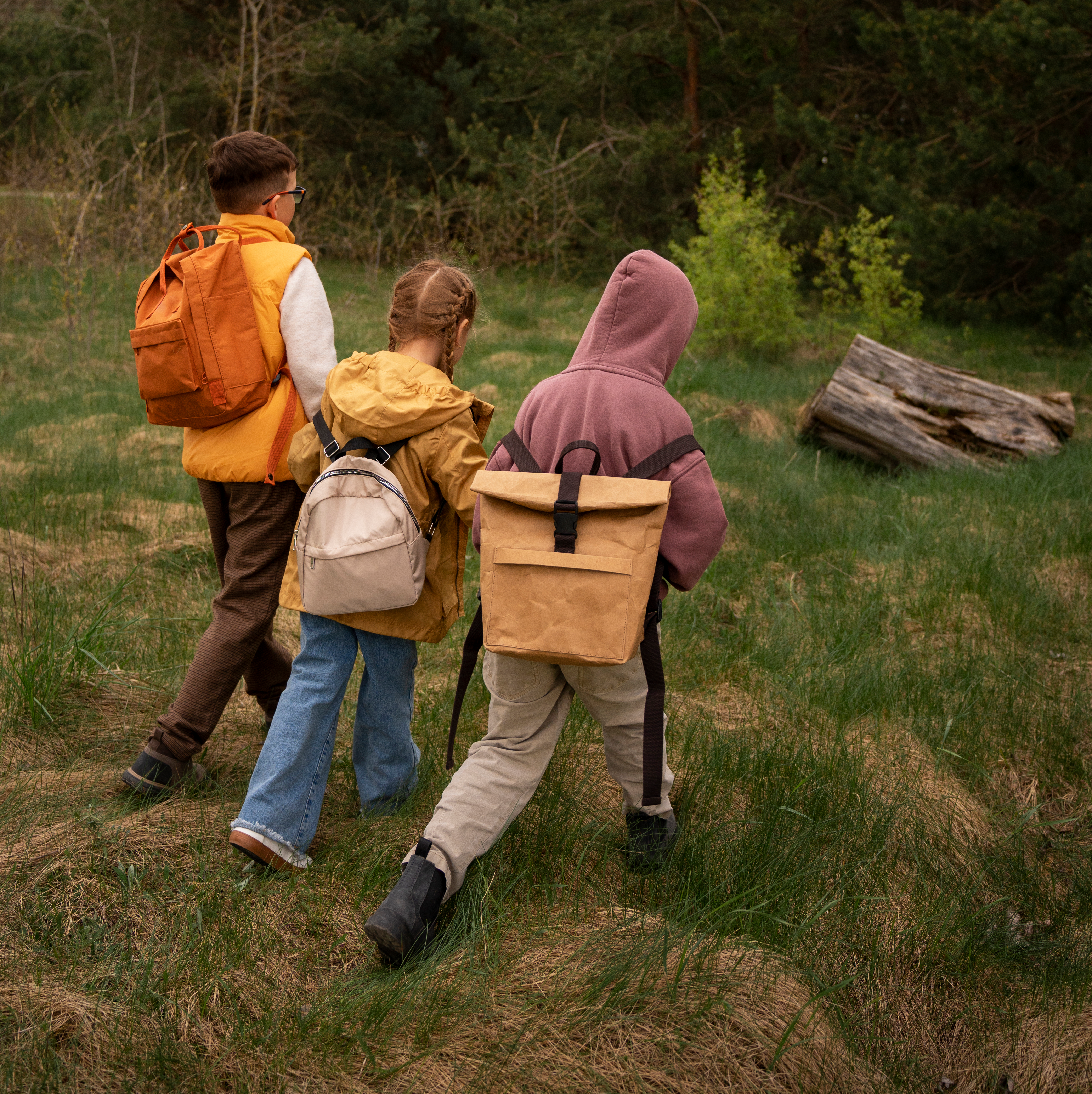 view-little-kids-with-backpacks-spending-time-nature-outdoors